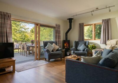 Open plan living area at Scots Pine holiday home, Grenville, Hampshire