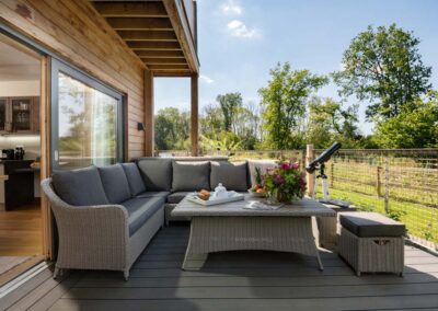 Relax outside on the decking area at Scots Pine, Grenville, Hampshire