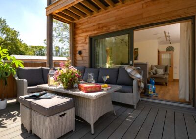 Outdoor decking area at Sicilian Lemon holiday house, Hampshire. Perfect for families.