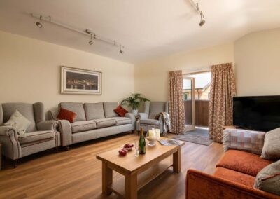 Cosy upstairs living area at Sicilian Lemon woodland holiday house in Hampshire