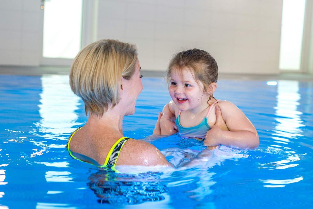 Mum and daughter using the beautiful indoor heated swimming pool at Wallops Wood in Hampshire. Our information for guests gives details about the exclusive daily swim sessions
