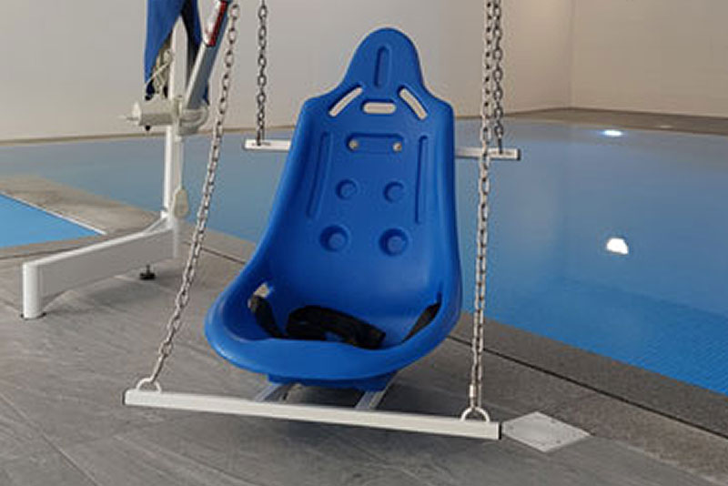 Moulded seat hoist for access to the swimming pool and jacuzzi at Wallops Wood